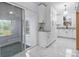 Modern kitchen featuring white cabinets, granite countertops, and tile flooring at 805 East St, Albemarle, NC 28001