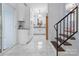 Bright kitchen features white cabinets, granite countertops, and marble tile flooring at 805 East St, Albemarle, NC 28001