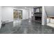 Cozy living room with stone floors, a fireplace, and sliding doors that brighten the space at 805 East St, Albemarle, NC 28001