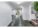 Open-concept living room with stone flooring and sliding glass doors to the outdoor space at 805 East St, Albemarle, NC 28001