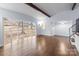 Open living room boasts hardwood floors, large windows and lots of natural light at 805 East St, Albemarle, NC 28001