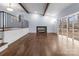 Bright living room featuring hardwood floors, fireplace, and large windows at 805 East St, Albemarle, NC 28001