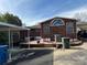 View of the backyard featuring a brick patio and carport, offering outdoor space at 816 Horah W St, Salisbury, NC 28144