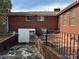 Spacious brick backyard with an outdoor patio, utility access and mature landscaping at 816 Horah W St, Salisbury, NC 28144
