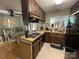 Compact kitchen featuring wooden cabinets and standard appliances, perfect for a cozy home at 816 Horah W St, Salisbury, NC 28144