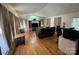 Spacious living room with wood floors, large windows, and built-in shelving at 816 Horah W St, Salisbury, NC 28144