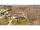 A sprawling property with the home, a pool, various outbuildings, and surrounded by woods is captured in an aerial view at 822 Bethlehem Rd, Kings Mountain, NC 28086