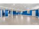 Finished basement with blue walls, tiled ceilings, and durable flooring, perfect for entertaining or relaxing at 822 Bethlehem Rd, Kings Mountain, NC 28086