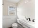 Cozy bathroom with tiled walls, granite countertop, and a large window for natural light at 822 Bethlehem Rd, Kings Mountain, NC 28086