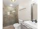 Modern bathroom features a glass shower, white toilet, and a sleek vanity with solid surface counters at 822 Bethlehem Rd, Kings Mountain, NC 28086