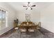 Formal dining room with wooden table, chairs, a decorative rug, and a window, perfect for gatherings at 822 Bethlehem Rd, Kings Mountain, NC 28086