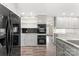 Bright kitchen featuring gray cabinets and black appliances at 822 Bethlehem Rd, Kings Mountain, NC 28086