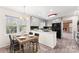 Charming kitchen with gray cabinets, black appliances, breakfast bar and dining area with natural light at 822 Bethlehem Rd, Kings Mountain, NC 28086