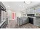 Traditional kitchen with gray cabinets, wood flooring, and modern appliances at 822 Bethlehem Rd, Kings Mountain, NC 28086