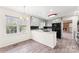 Traditional kitchen with gray cabinets, wood flooring, and backyard views at 822 Bethlehem Rd, Kings Mountain, NC 28086