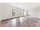Open living room with hardwood floors, neutral walls, and ample natural light at 822 Bethlehem Rd, Kings Mountain, NC 28086