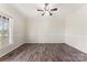 Inviting room with wood-look floors and ceiling fan at 822 Bethlehem Rd, Kings Mountain, NC 28086