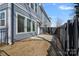 Cozy backyard with a private patio and fence, providing an intimate outdoor space at 8233 Houser St, Cornelius, NC 28031