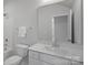 Clean, bright bathroom with a shower-tub, a large mirror, and a white vanity at 8233 Houser St, Cornelius, NC 28031