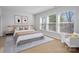 Bright primary bedroom features large windows and neutral finishes at 8233 Houser St, Cornelius, NC 28031