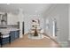 Bright breakfast nook features modern lighting, a table, and a door to the exterior at 8233 Houser St, Cornelius, NC 28031
