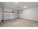 Spacious garage with an automatic door and ample room for parking and storage at 8233 Houser St, Cornelius, NC 28031