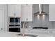 Bright kitchen features stainless steel appliances, a decorative backsplash, and gold hardware at 8233 Houser St, Cornelius, NC 28031