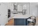 Elegant kitchen with a large island, quartz countertops, and stainless steel appliances at 8233 Houser St, Cornelius, NC 28031