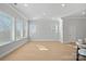 Sun-drenched living room with hardwood floors and large windows at 8233 Houser St, Cornelius, NC 28031