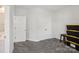 Neutral bedroom featuring double closets and entry into an on-suite bathroom with ample space for storage at 8638 Raven Top Dr, Mint Hill, NC 28227