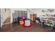 Bonus room with hardwood floors, offering versatile space for lounging and home office area at 8638 Raven Top Dr, Mint Hill, NC 28227