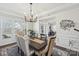Well-lit dining room area with large windows and stylish decor at 8638 Raven Top Dr, Mint Hill, NC 28227