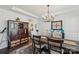 Elegant dining room with stylish chandelier, molding, and large buffet at 8638 Raven Top Dr, Mint Hill, NC 28227
