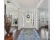 Bright foyer with hardwood floors and an area rug at 8638 Raven Top Dr, Mint Hill, NC 28227