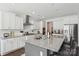 Bright kitchen with granite counters, white cabinets, and stainless-steel appliances at 8638 Raven Top Dr, Mint Hill, NC 28227
