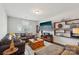 Comfortable living room with oversized TV and wooden furniture at 8638 Raven Top Dr, Mint Hill, NC 28227