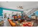 Open-concept living room with a modern staircase and seamless view into the white kitchen at 8638 Raven Top Dr, Mint Hill, NC 28227
