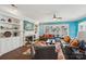 Cozy living room featuring a fireplace, built-in shelving, and a view to the outdoors at 8638 Raven Top Dr, Mint Hill, NC 28227