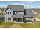 Expansive backyard featuring a covered patio perfect for entertaining and relaxing at 8638 Raven Top Dr, Mint Hill, NC 28227