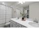 Bathroom featuring double vanity with white countertop, modern fixtures, and plenty of space at 9042 Northfield Crossing Dr, Charlotte, NC 28269