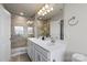 Elegant bathroom features a double vanity, granite countertops, a large mirror, and a glass shower at 9042 Northfield Crossing Dr, Charlotte, NC 28269