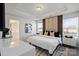 Bright bedroom with a stylish upholstered headboard, tray ceiling, and dual windows at 9042 Northfield Crossing Dr, Charlotte, NC 28269