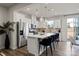 Modern kitchen with stainless steel appliances, a center island with seating, and ample natural light at 9042 Northfield Crossing Dr, Charlotte, NC 28269