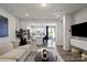 Inviting living room with an open layout leading to the modern kitchen and dining area at 9042 Northfield Crossing Dr, Charlotte, NC 28269