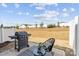 Cozy patio area featuring a grill and outdoor seating, ideal for relaxing and enjoying the outdoors at 9042 Northfield Crossing Dr, Charlotte, NC 28269