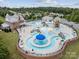 Aerial view showcasing the community pool area with multiple pools, water features, lounge chairs, and clubhouse at 924 Stebbins Dr, Fort Mill, SC 29715