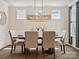 A dining room bathed in natural light, featuring a decorative light fixture and well-placed decor at 924 Stebbins Dr, Fort Mill, SC 29715