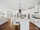 Beautiful kitchen with a large island, stainless steel appliances, hardwood floors and open floor plan at 924 Stebbins Dr, Fort Mill, SC 29715