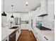 Contemporary kitchen featuring white cabinets, stainless steel appliances, a gas cooktop and ample counter space at 924 Stebbins Dr, Fort Mill, SC 29715