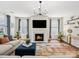 Inviting living room featuring a cozy fireplace, modern lighting, and stylish decor at 924 Stebbins Dr, Fort Mill, SC 29715